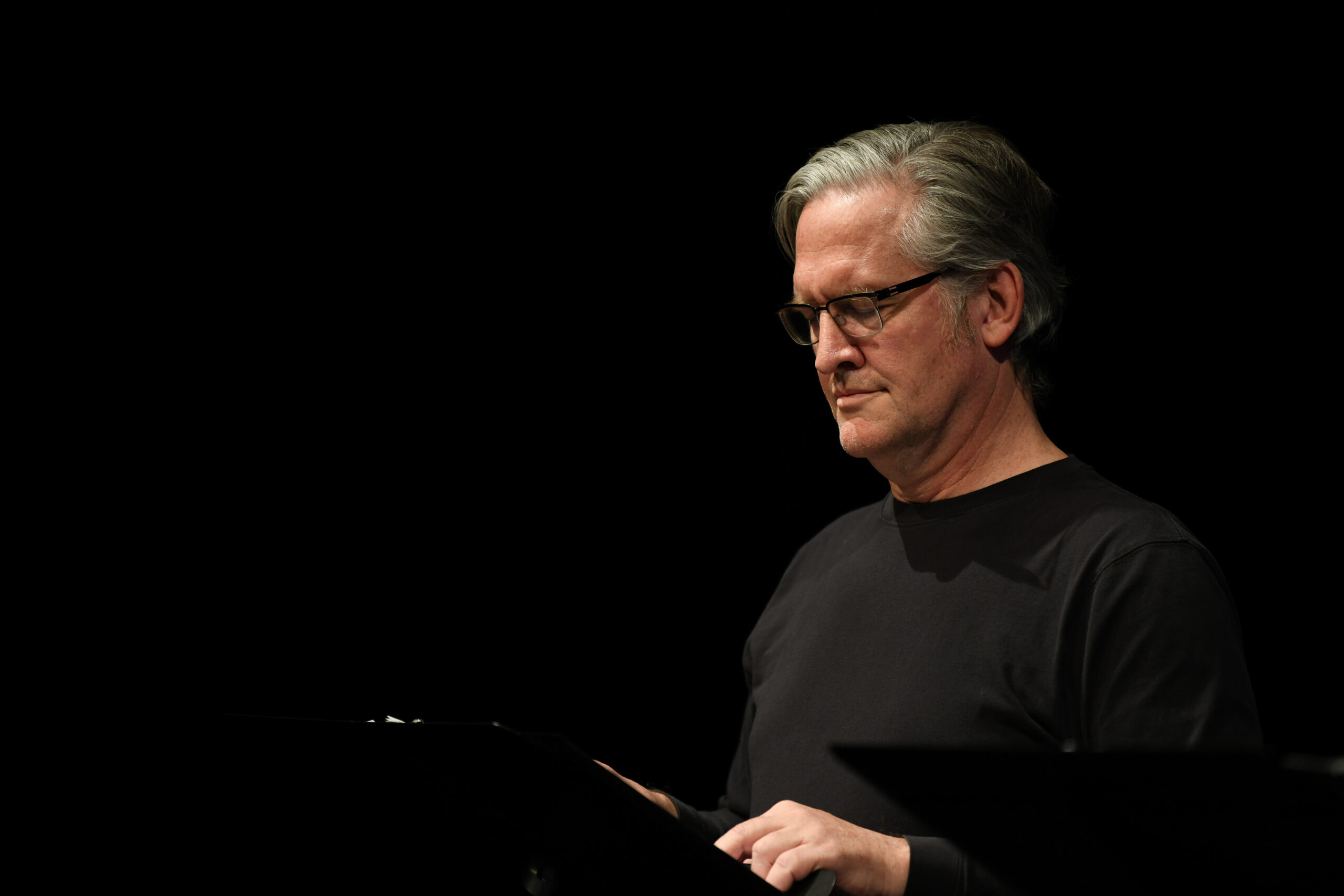 Michael Scherer at podium for reading of The Life of Galileo at Boise State University.