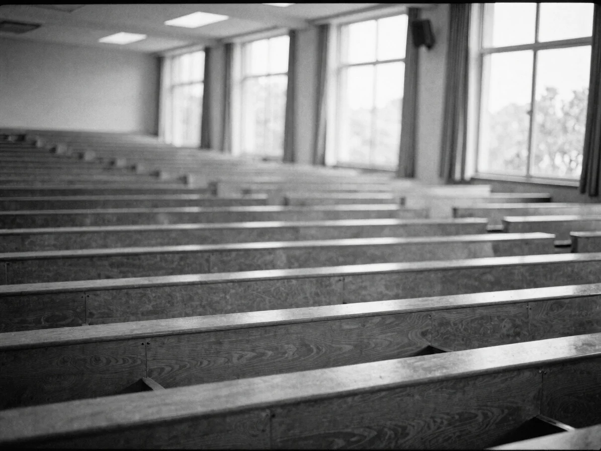 Black-and-white editorial documentary photograph of a university